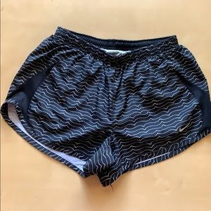 Black Nike Tempo shorts with white wave pattern